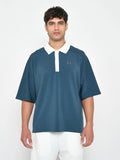Equinox Relaxed Fit Polo in dark denim, on the model
